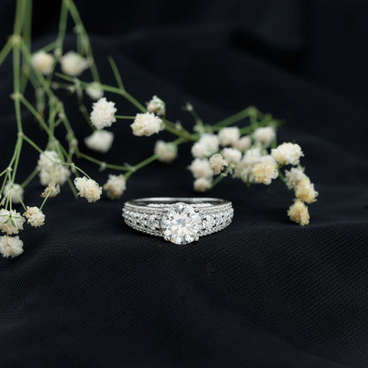 Round Brilliant Cut Moissanite Side Stone Engagement Ring