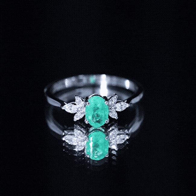 Oval Shaped Emerald Engagement Ring with Marquise Diamond Trio