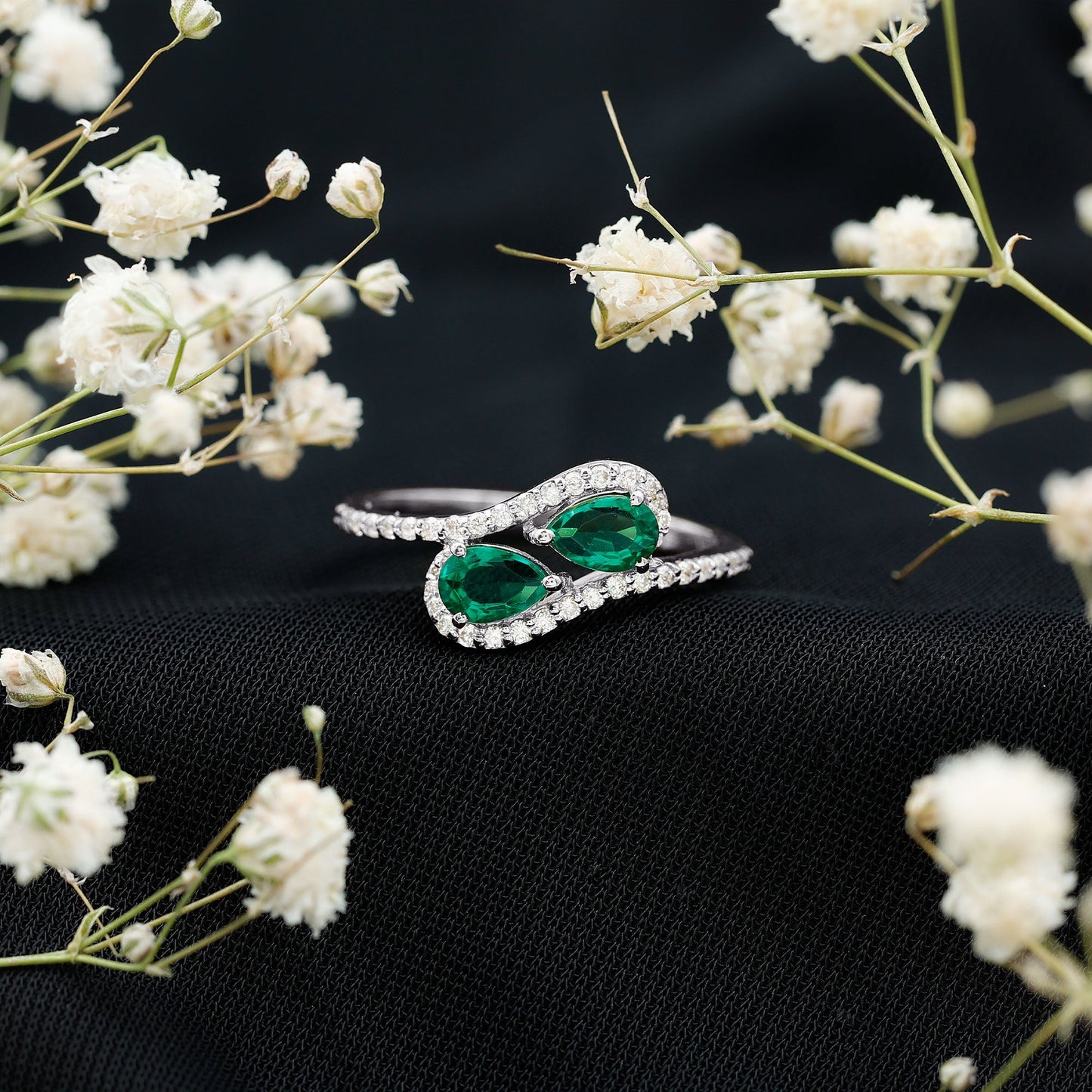 Pear Shape Created Emerald and Diamond Bypass Engagement Ring