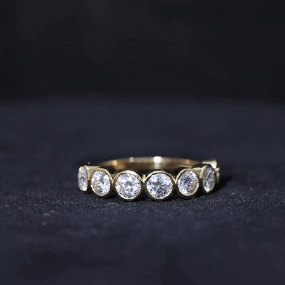 Round Moissanite Half Eternity Ring in Bezel Setting
