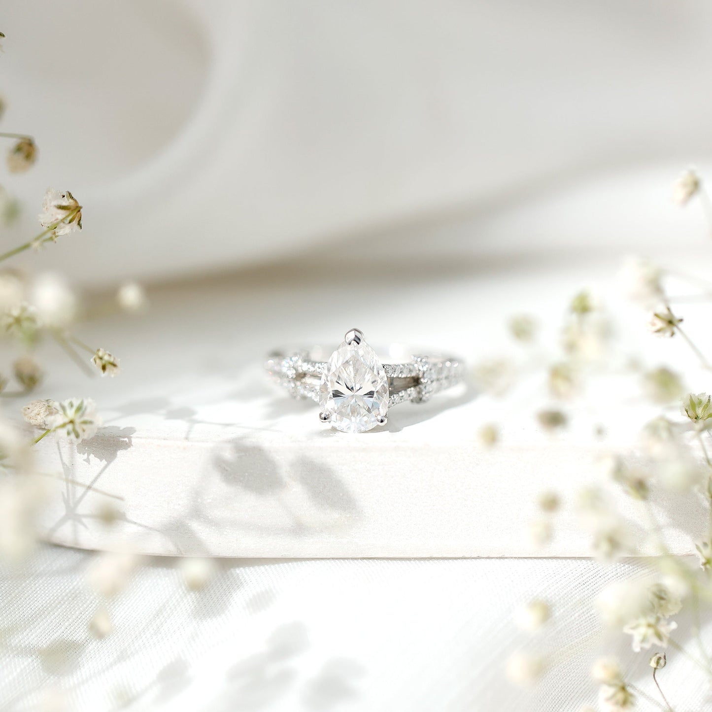 Pear Shaped Moissanite Solitaire Engagement Ring in Split Shank