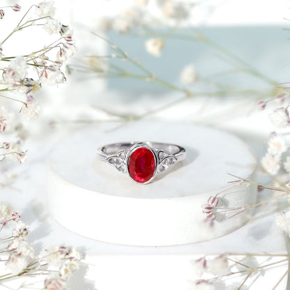 Oval Shaped 1.5 Carat Lab Grown Ruby Celtic Engagement Ring in Bezel Setting