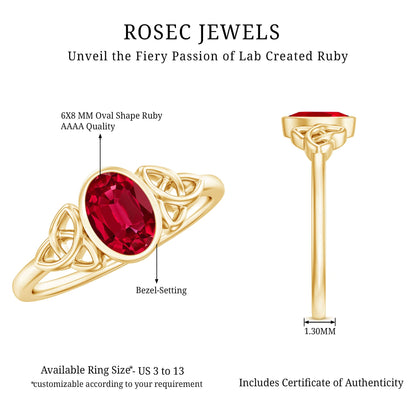 Oval Shaped 1.5 Carat Lab Grown Ruby Celtic Engagement Ring in Bezel Setting