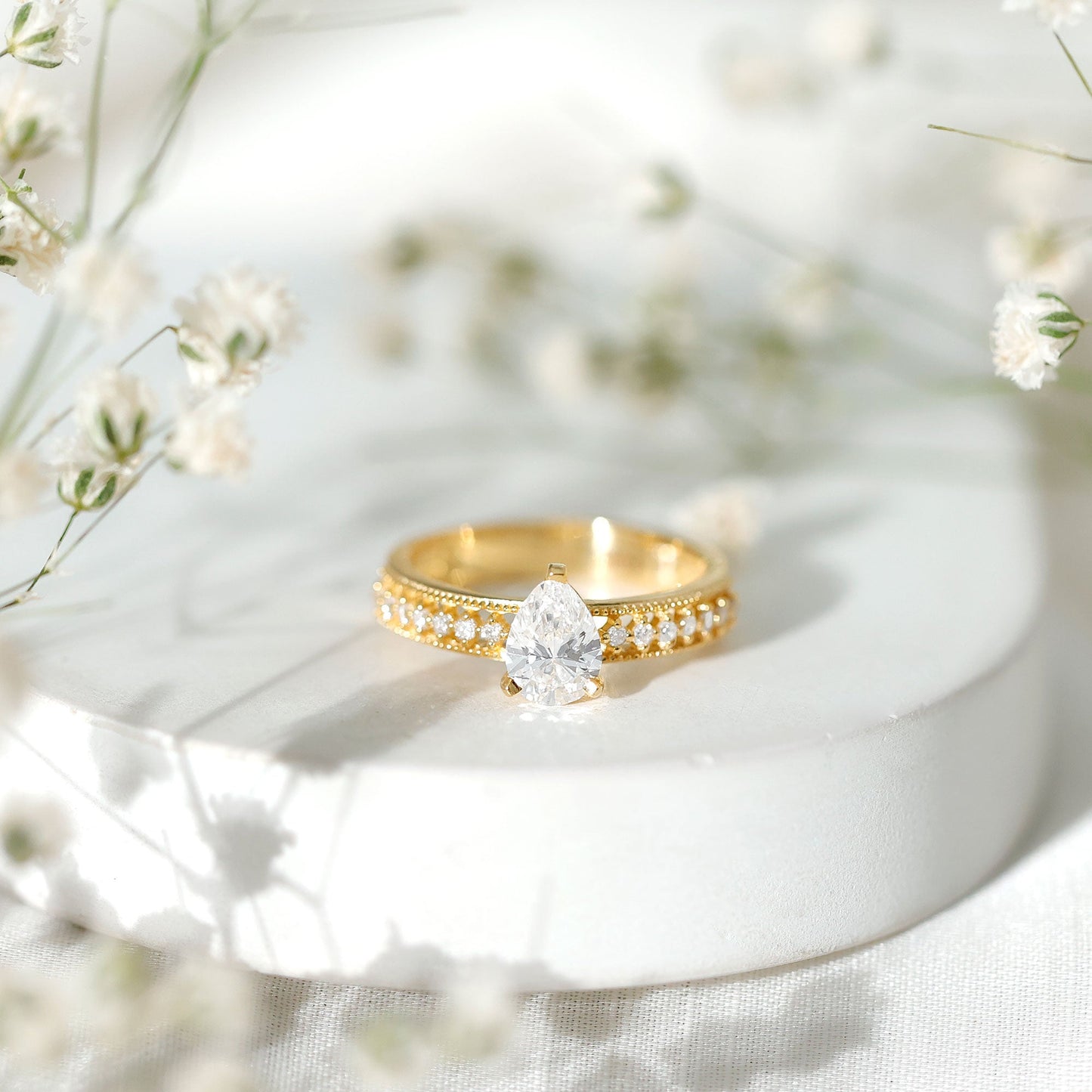 Pear Shaped Moissanite Solitaire Engagement Ring with Beaded Design