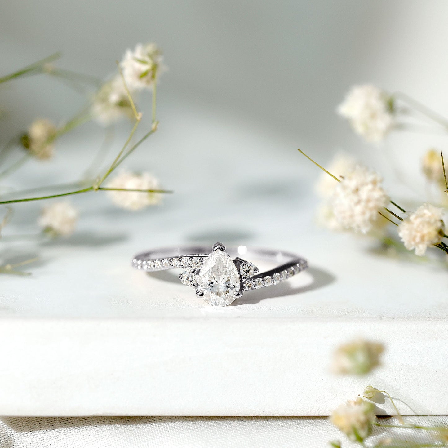 Pear Cut Moissanite Bypass Engagement Ring with Side Stones