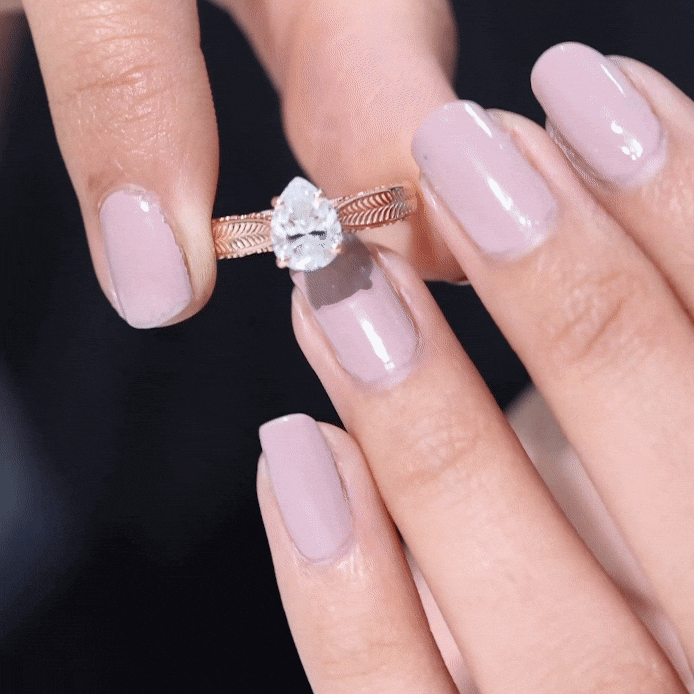Claw Set Pear Shape Moissanite Engagement Ring