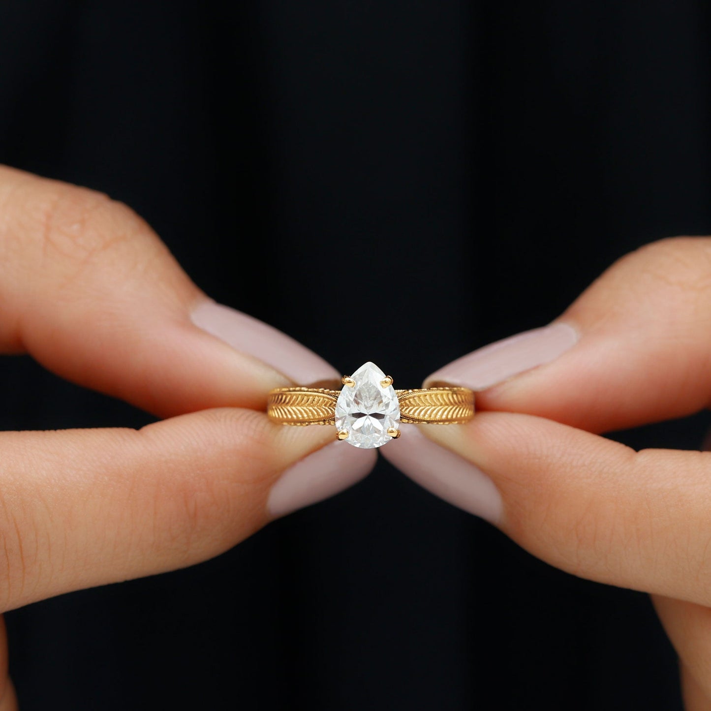 Claw Set Pear Shape Moissanite Engagement Ring