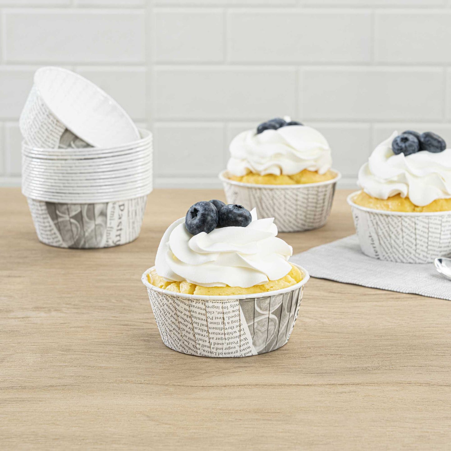 Panificio 5 oz Round Newsprint Paper Large Baking Cup - Pleated - 3 3/4" x 3 3/4" x 1 1/2" - 200 count box