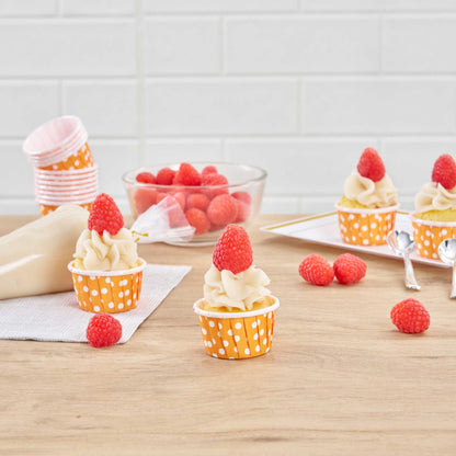 Panificio 1 oz Round Polka-Dotted Hot Orange Paper Small Baking Cup - Pleated - 2" x 2" x 1 1/4" - 200 count box