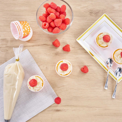 Panificio 1 oz Round Polka-Dotted Hot Orange Paper Small Baking Cup - Pleated - 2" x 2" x 1 1/4" - 200 count box