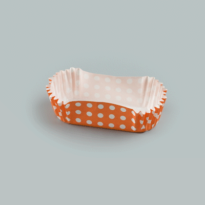 Panificio 1 oz Elliptical Polka-Dotted Hot Orange Paper Regular Baking Cup - Ridged - 3 1/2" x 1 1/2" x 3/4" - 200 count box
