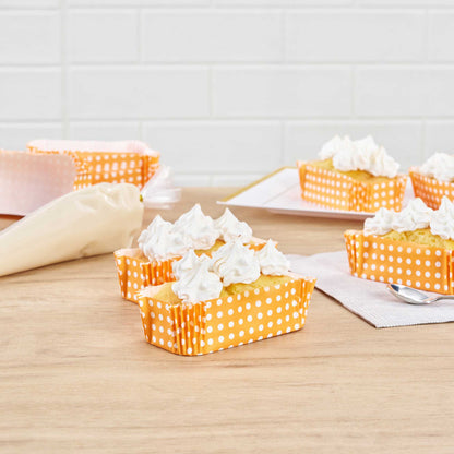 Panificio 5 oz Elliptical Polka-Dotted Hot Orange Paper Large Baking Cup - Ridged - 4 1/2" x 2 1/2" x 1 1/4" - 200 count box
