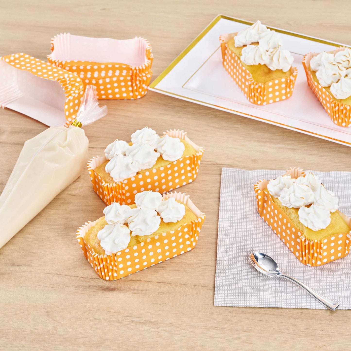 Panificio 5 oz Elliptical Polka-Dotted Hot Orange Paper Large Baking Cup - Ridged - 4 1/2" x 2 1/2" x 1 1/4" - 200 count box