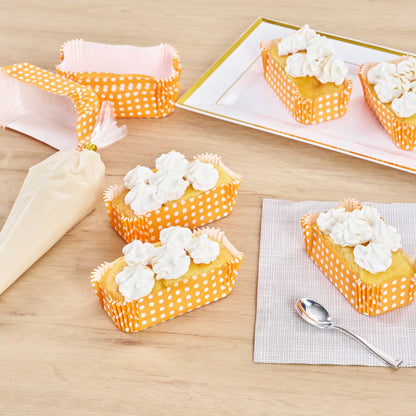Panificio 5 oz Elliptical Polka-Dotted Hot Orange Paper Large Baking Cup - Ridged - 4 1/2" x 2 1/2" x 1 1/4" - 200 count box