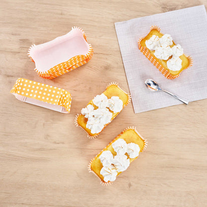 Panificio 5 oz Elliptical Polka-Dotted Hot Orange Paper Large Baking Cup - Ridged - 4 1/2" x 2 1/2" x 1 1/4" - 200 count box