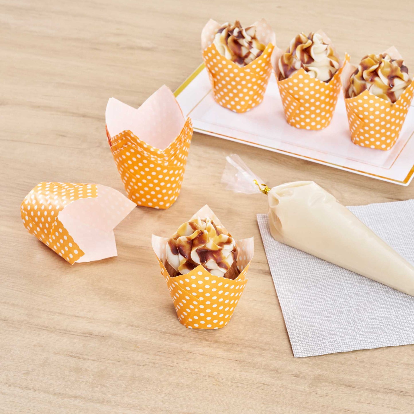 Panificio 2 oz Tulip Polka-Dotted Hot Orange Paper Tall Baking Cup - 3 1/4" x 3 1/4" x 3 1/2" - 200 count box