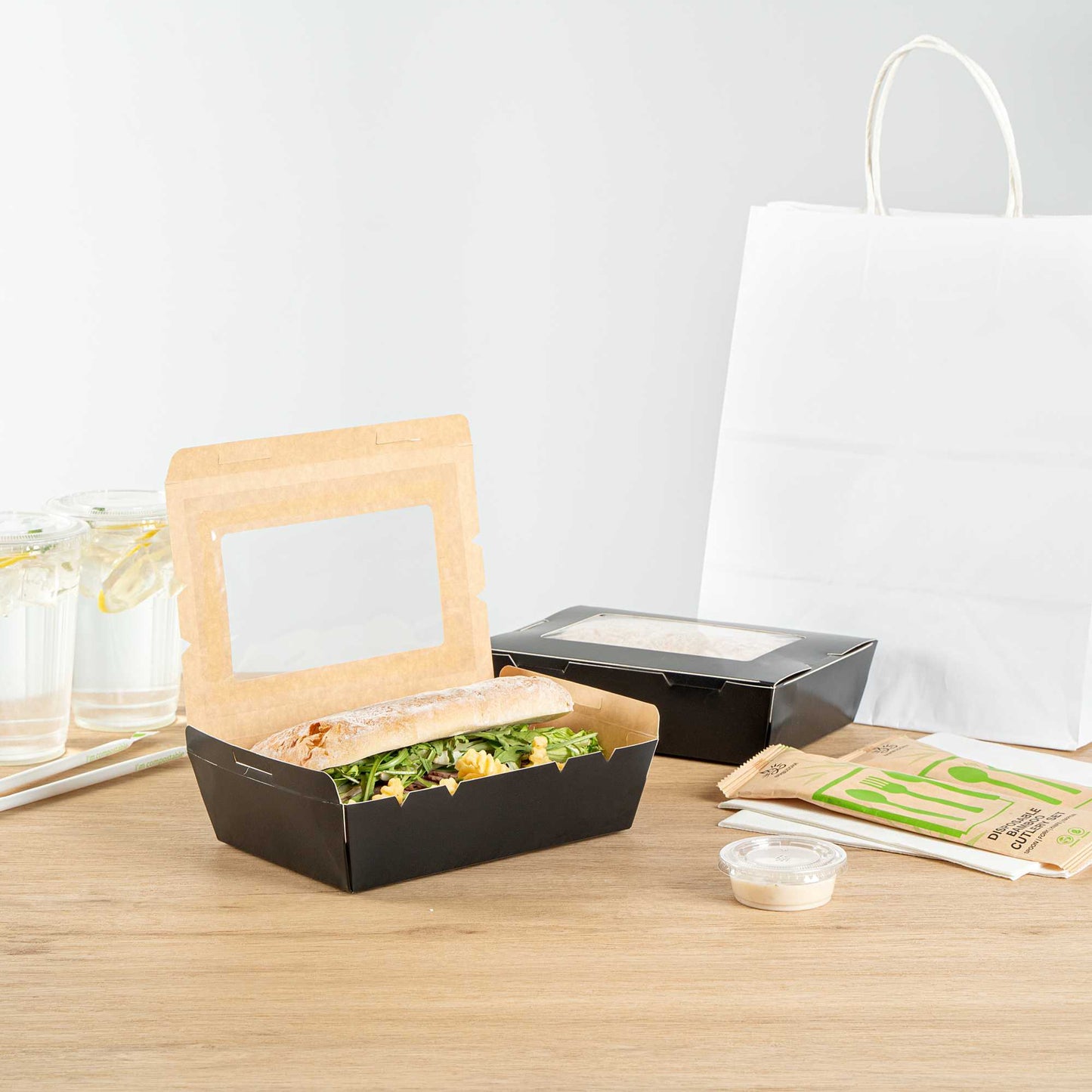 Cafe Vision 42 oz Black Paper Medium Take Out Container - Hinge Lock - 8" x 5 1/2" x 2" - 200 count box