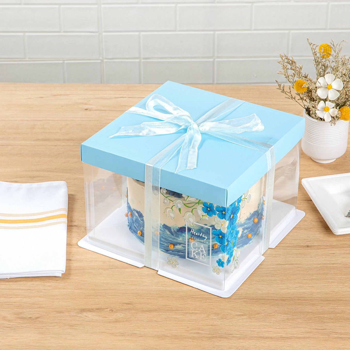 Sweet Vision Square Clear Plastic Cake Box - Blue Lid and White Base, Blue Ribbon, Flower Accent - 8 1/2" x 8 1/2" x 6 3/4" - 10 count box