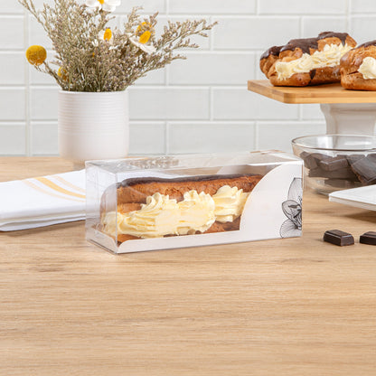 Sweet Vision Rectangle Clear Plastic Eclair Box - White Paper Sleeve, Lotus Accent - 7" x 2 1/2" x 2 1/2" - 100 count box