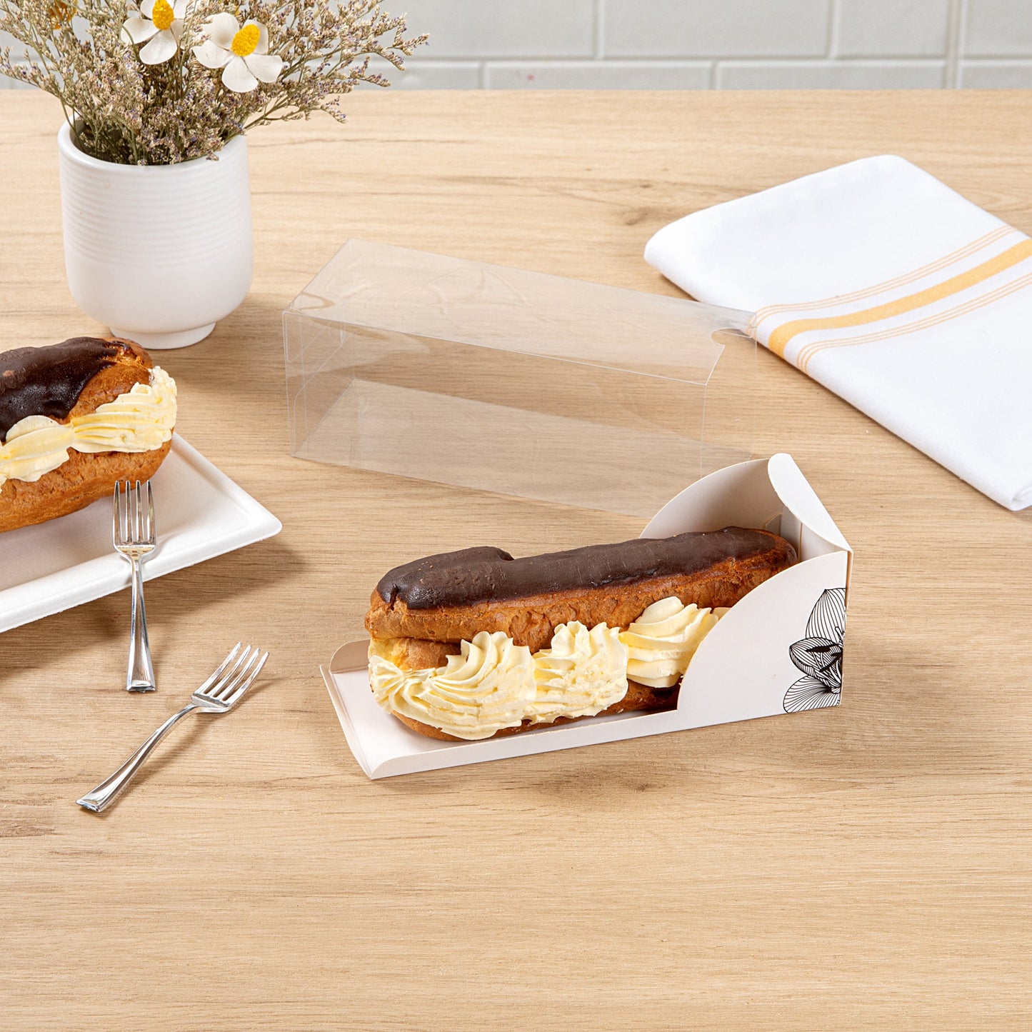 Sweet Vision Rectangle Clear Plastic Eclair Box - White Paper Sleeve, Lotus Accent - 7" x 2 1/2" x 2 1/2" - 100 count box