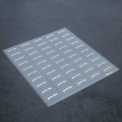 Label Tek Plastic Green Tea Label - Clear with White Font, Water-Resistant - 2" x 1" - 100 count box