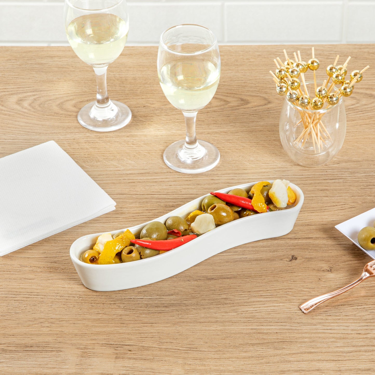 Chef 101 Swerve 6 oz Curved White Porcelain Olive Plate - 8 3/4" x 2 1/4" x 1 1/2" - 1 count box