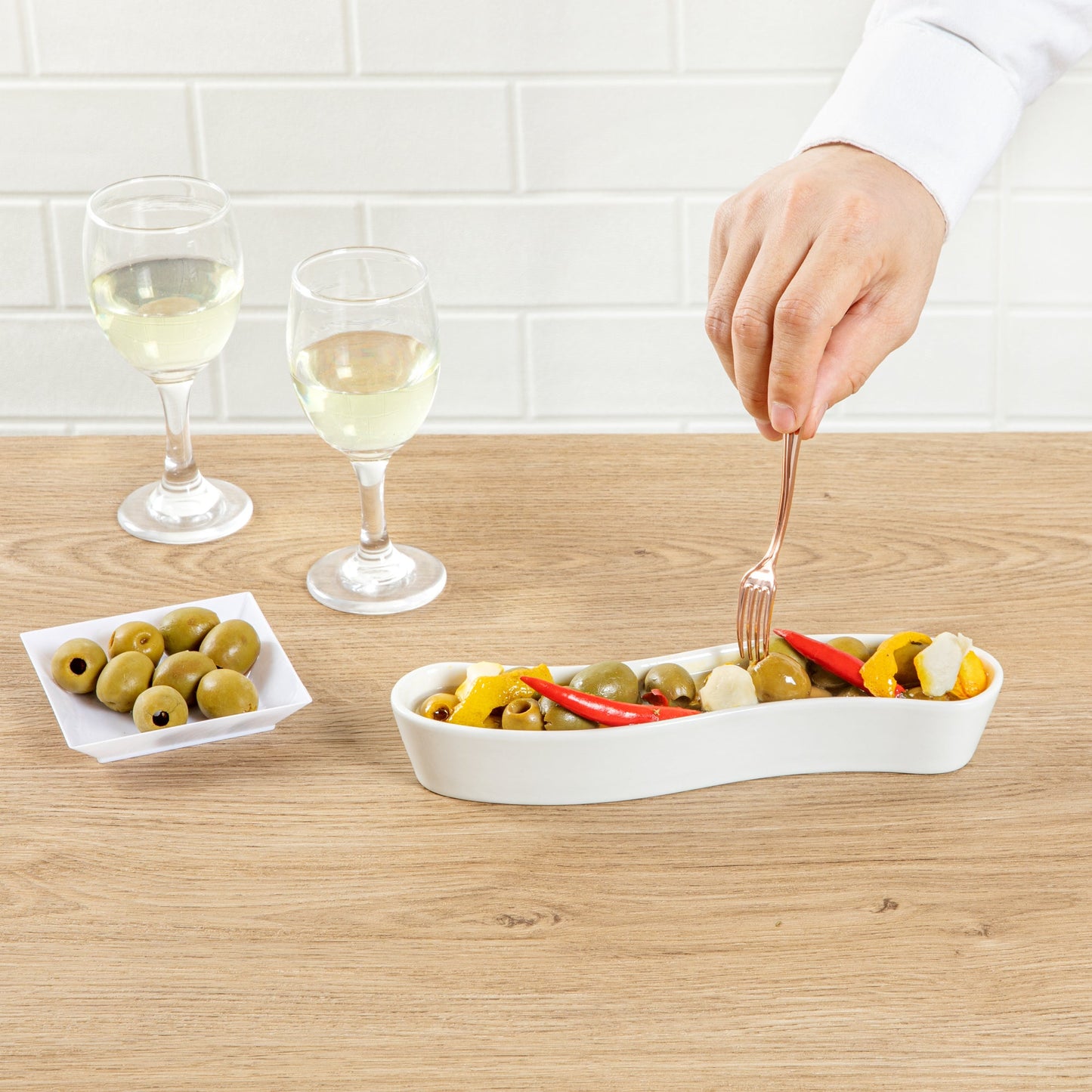Chef 101 Swerve 6 oz Curved White Porcelain Olive Plate - 8 3/4" x 2 1/4" x 1 1/2" - 1 count box