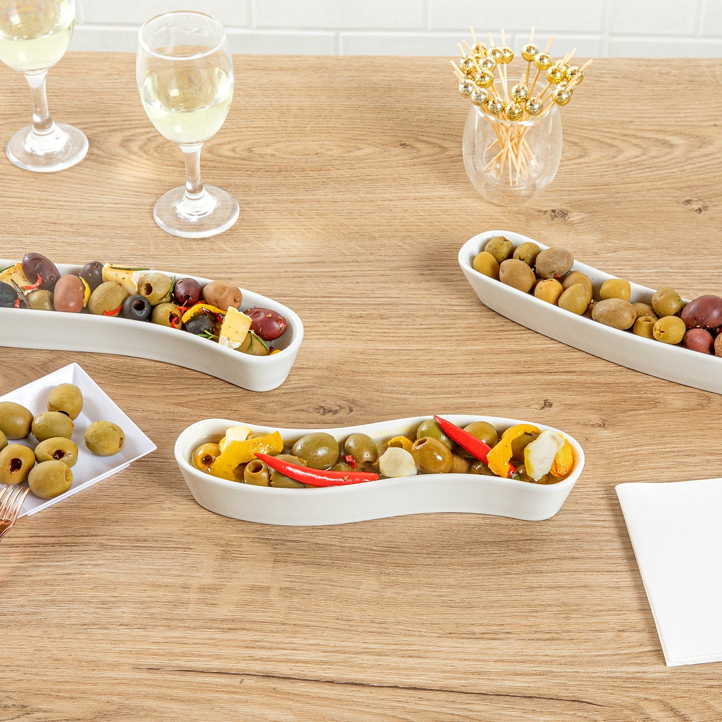 Chef 101 Swerve 6 oz Curved White Porcelain Olive Plate - 8 3/4" x 2 1/4" x 1 1/2" - 1 count box