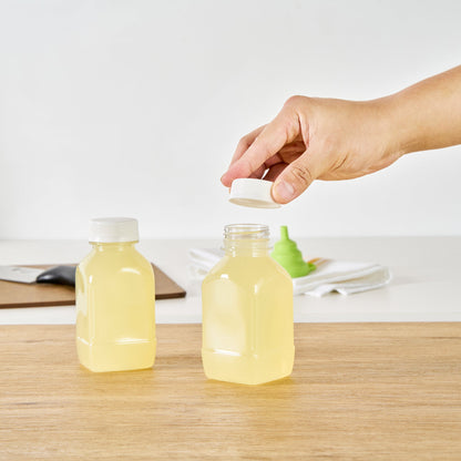 Bottle Tek 8 oz Square Clear Plastic Cold Pressed Juice Bottle - with Safety Cap - 2 1/4" x 2 1/4" x 4 3/4" - 100 count box