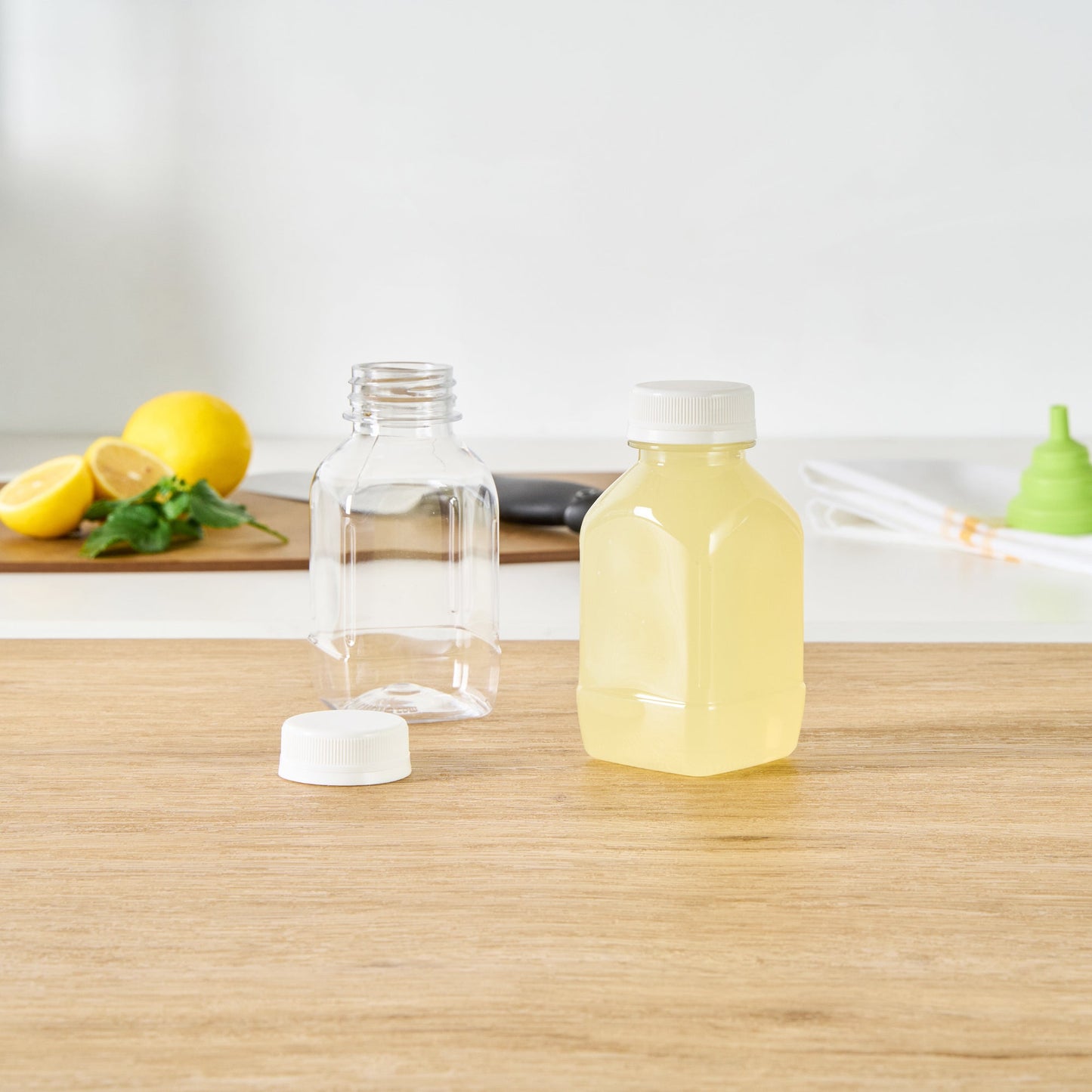 Bottle Tek 8 oz Square Clear Plastic Cold Pressed Juice Bottle - with Safety Cap - 2 1/4" x 2 1/4" x 4 3/4" - 100 count box
