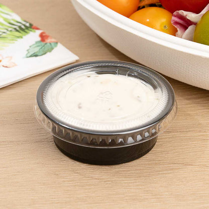 Chef 101 1.5 oz Round Black Plastic Portion Cup - 2 1/2" x 2 1/2" x 3/4" - 2000 count box