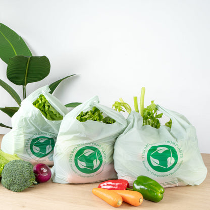 Basic Nature Green Plastic T-Shirt Bag - 1/6 Size, Compostable - 12" x 6 1/2" x 22" - 100 count box