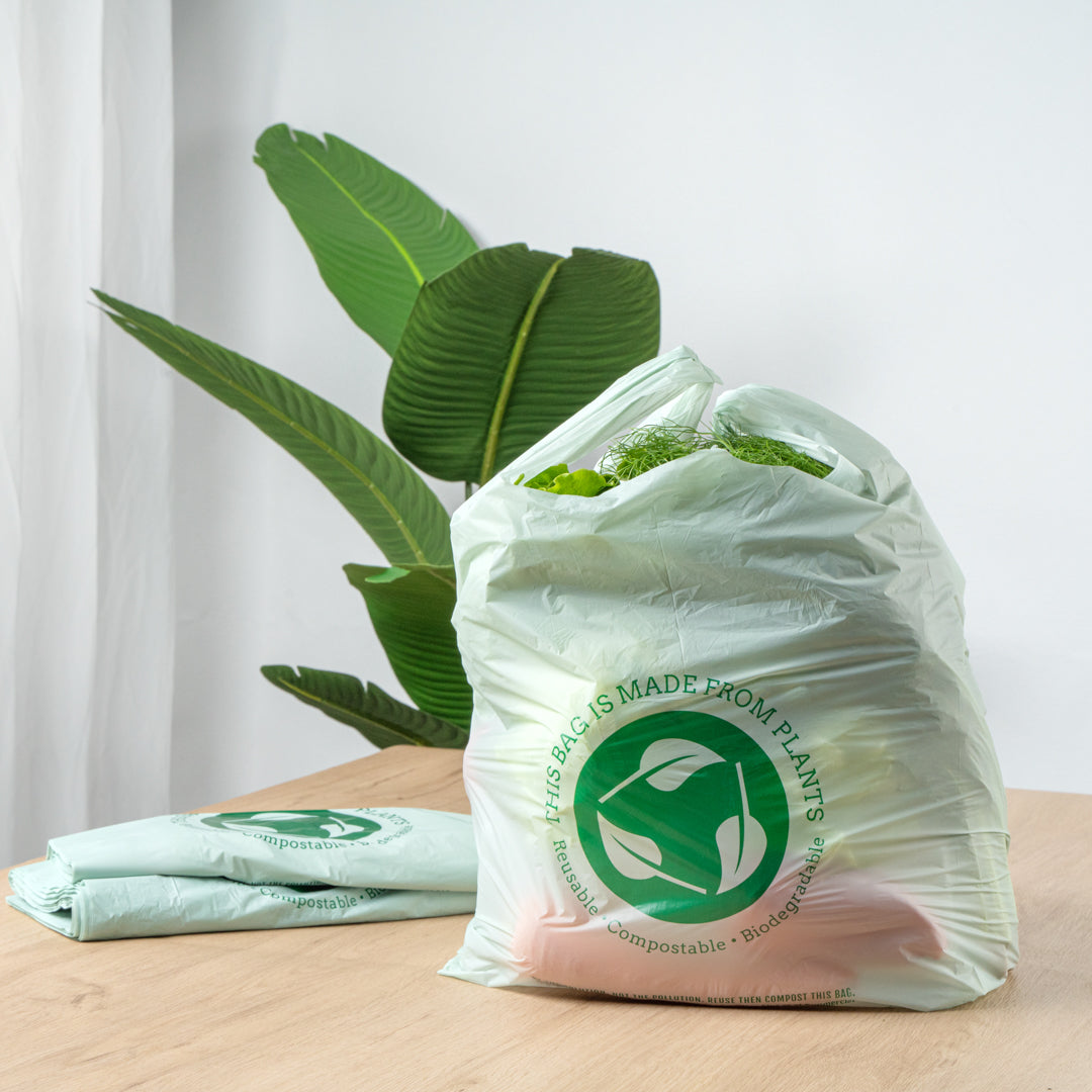 Basic Nature Green Plastic T-Shirt Bag - 1/6 Size, Compostable - 12" x 6 1/2" x 22" - 500 count box