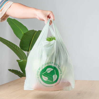 Basic Nature Green Plastic T-Shirt Bag - 1/6 Size, Compostable - 12" x 6 1/2" x 22" - 500 count box
