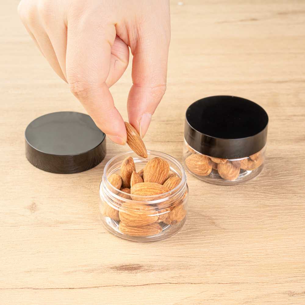 Chef 101 1 oz Round Clear Plastic Candy and Snack Jar - with Black Plastic Lid - 2" x 2" x 1 1/4" - 100 count box
