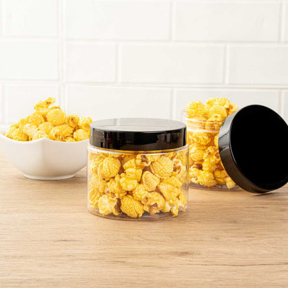 Chef 101 16 oz Round Clear Plastic Candy and Snack Jar - with Black Plastic Lid - 3 3/4" x 3 3/4" x 3" - 100 count box
