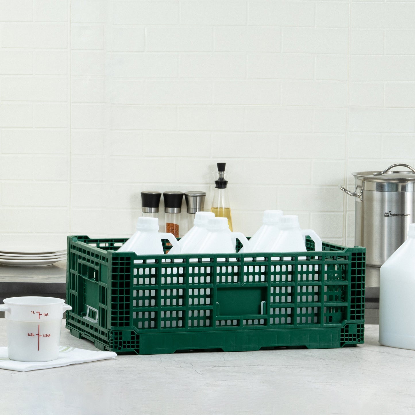 Cater Tek Rectangle Green Plastic 36L Collapsible Milk Crate - Stackable - 23 1/2" x 15 3/4" x 8 1/2" - 1 count box