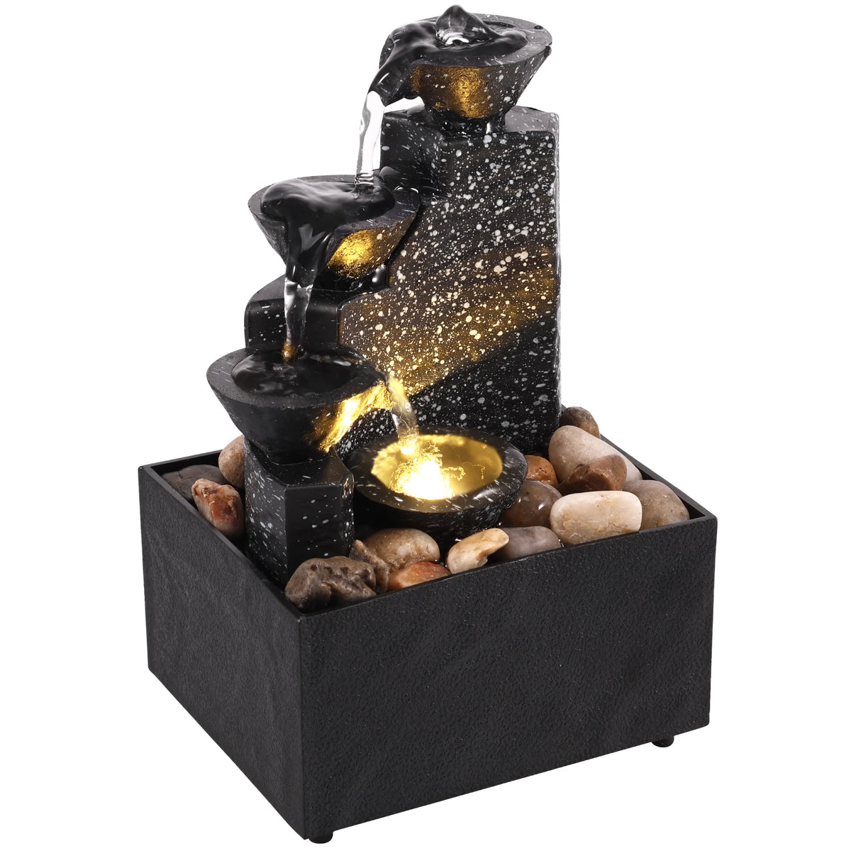 A tiered black stone fountain with gold glitter accents, water flowing from the top to a small gold bowl, set in a square black base filled with decorative stones on a white background.