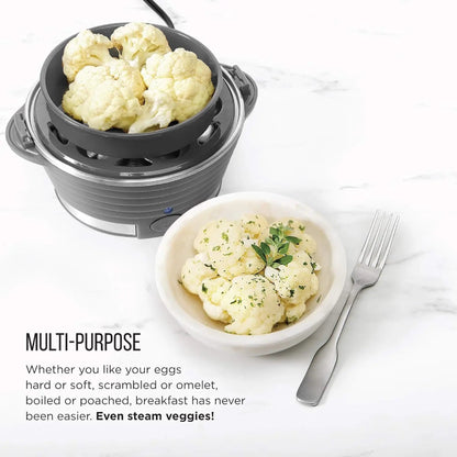Small appliance with cauliflower inside, next to a bowl of steamed cauliflower on a white surface.