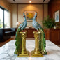 A pair of exquisite peacock ornaments standing on Roman columns add an artistic touch to the home.