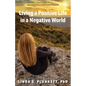 Living a Positive Life in a Negative World: My Uphill Journey - Paperback