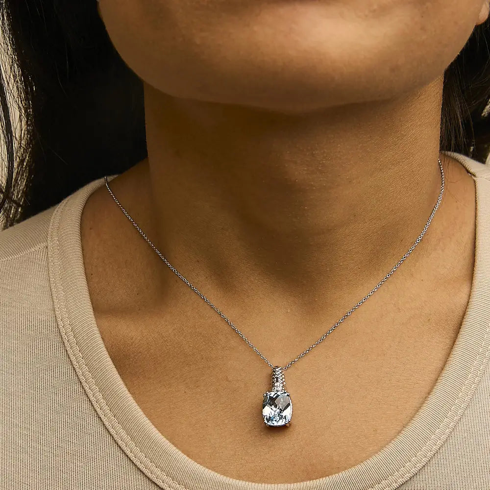 Cushion Blue Topaz and Diamond Textured Pendant in Sterling Silver