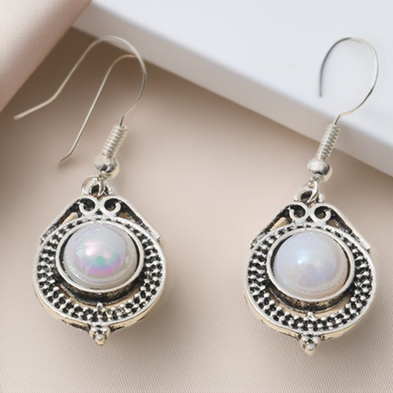 Silver Womens Drop Earrings With A Rotating Droplet Design