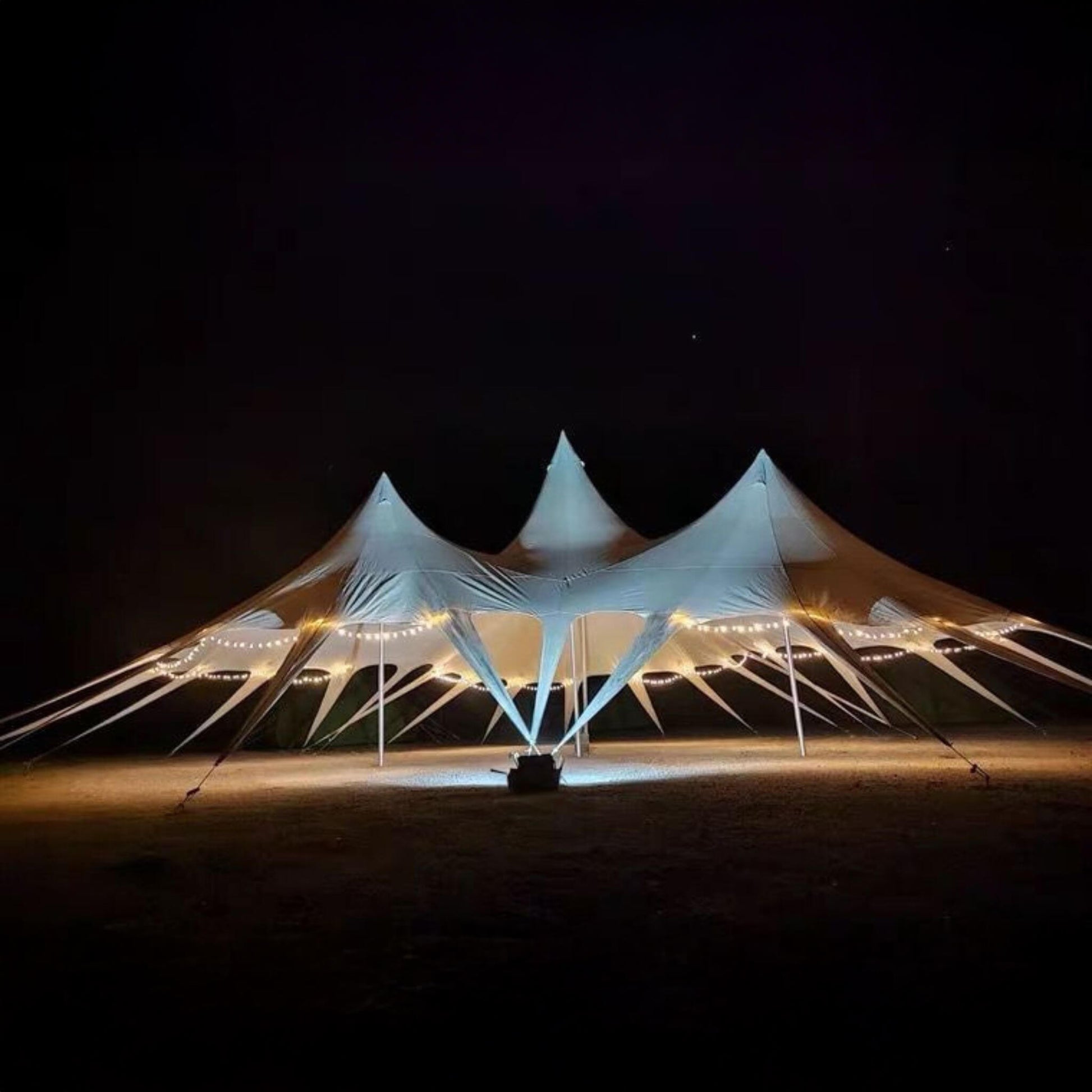 Outdoor rain tarp canopy at night camping