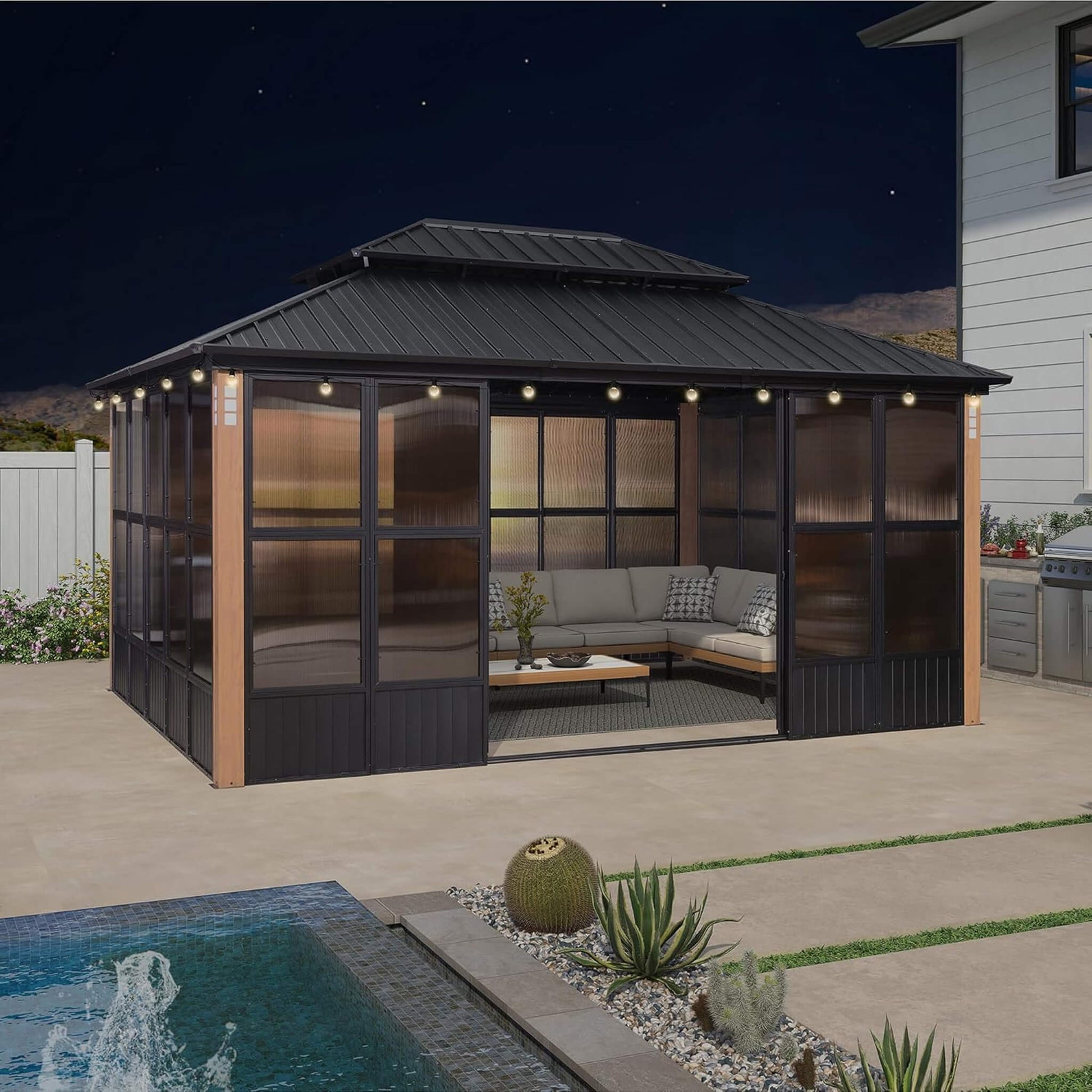 Alora Oasis 12x16 sunroom on patio at night
