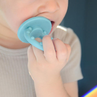 OiOi Baby Silicone Teether Toy - Soft Gum Soother for Teething Relief, 3 Months+, Green