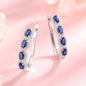 Sapphire Halo Simulated Huggie Earrings in Sterling Silver