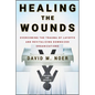 Healing the Wounds: Overcoming the Trauma of Layoffs and Revitalizing Downsized Organizations - Hardcover