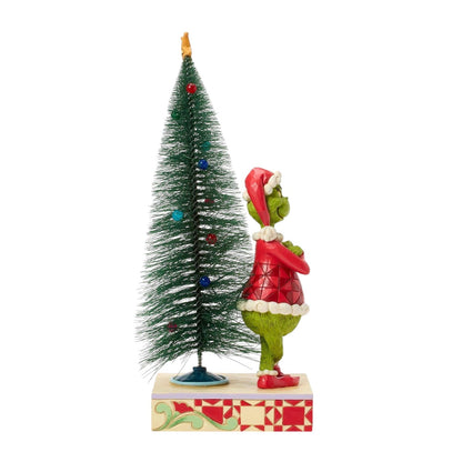 Grinch Stands in Front of the Tree